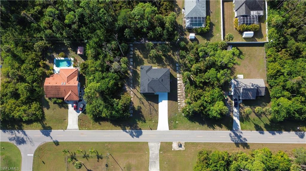 Aerial overview of property's location featuring nearby suburban area