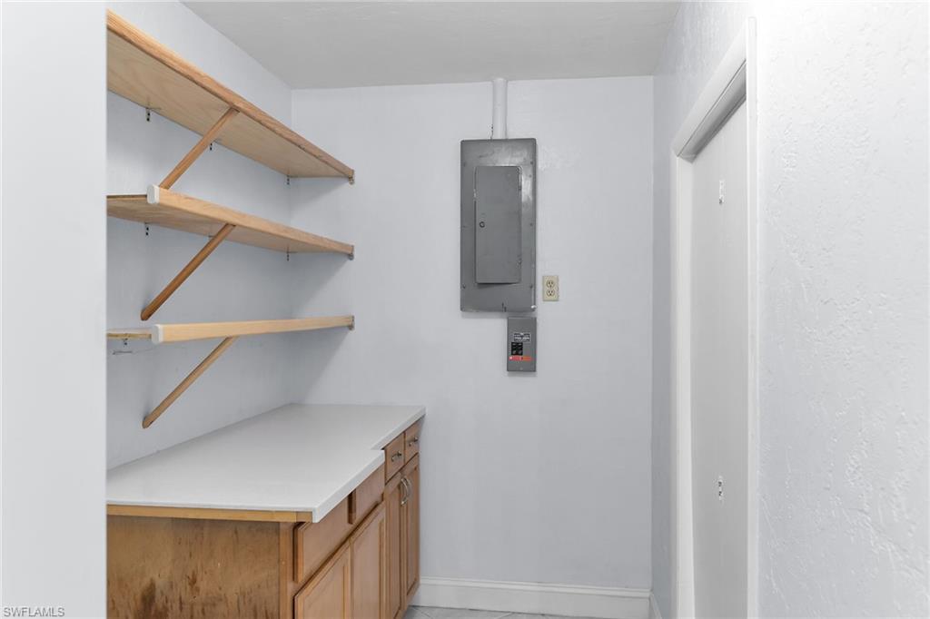Laundry room featuring electric panel