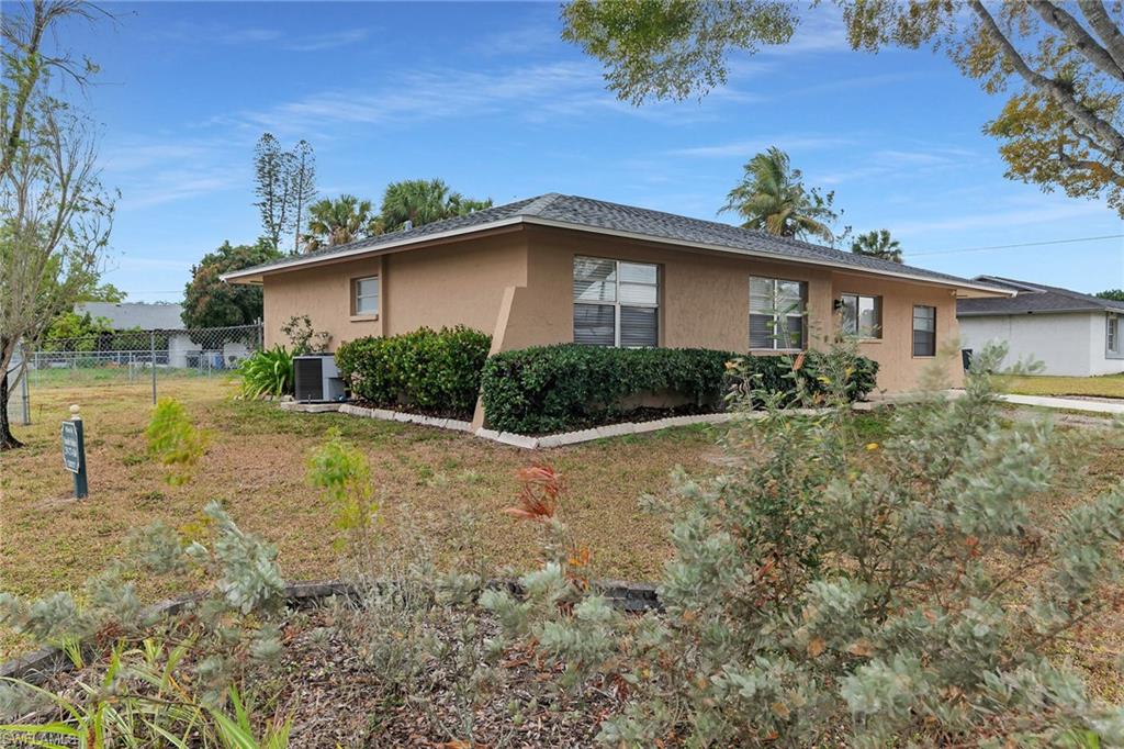 View of property exterior with stucco siding and a central air condition unit