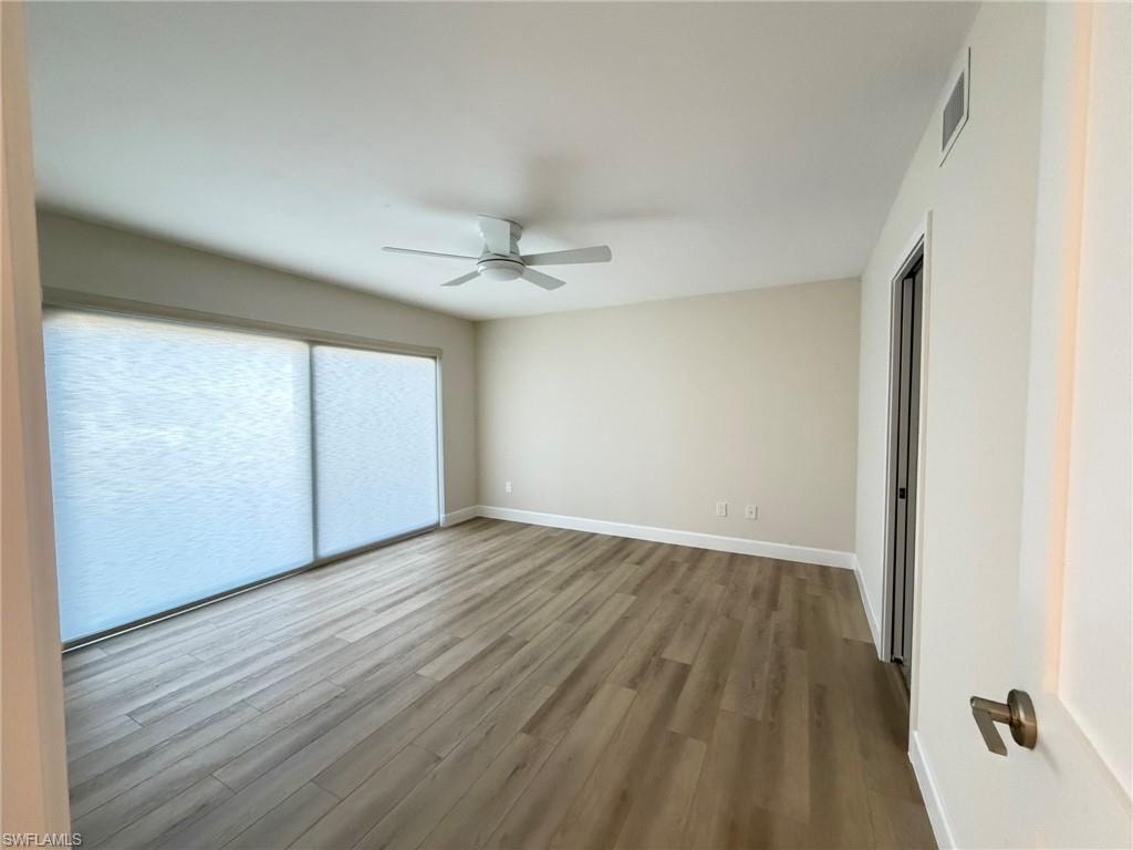 Spare room with light wood-style floors and ceiling fan