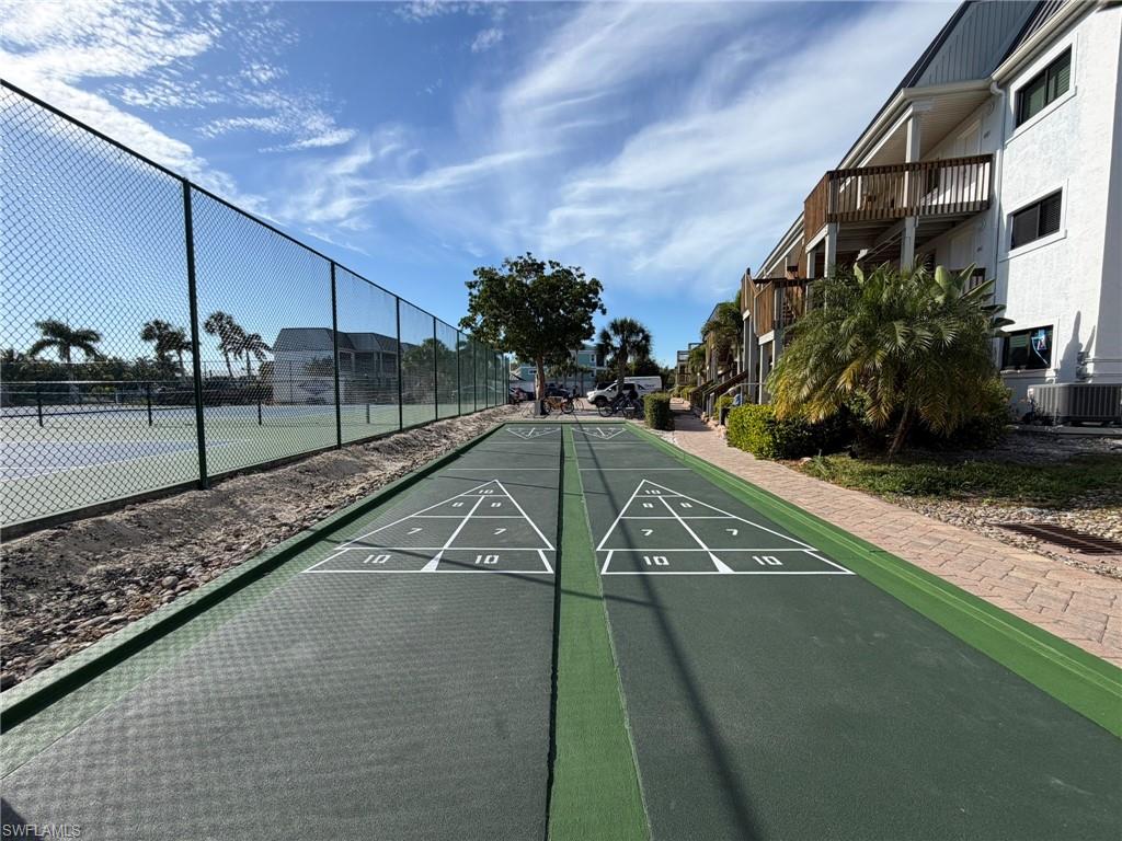 View of home's community with shuffleboard