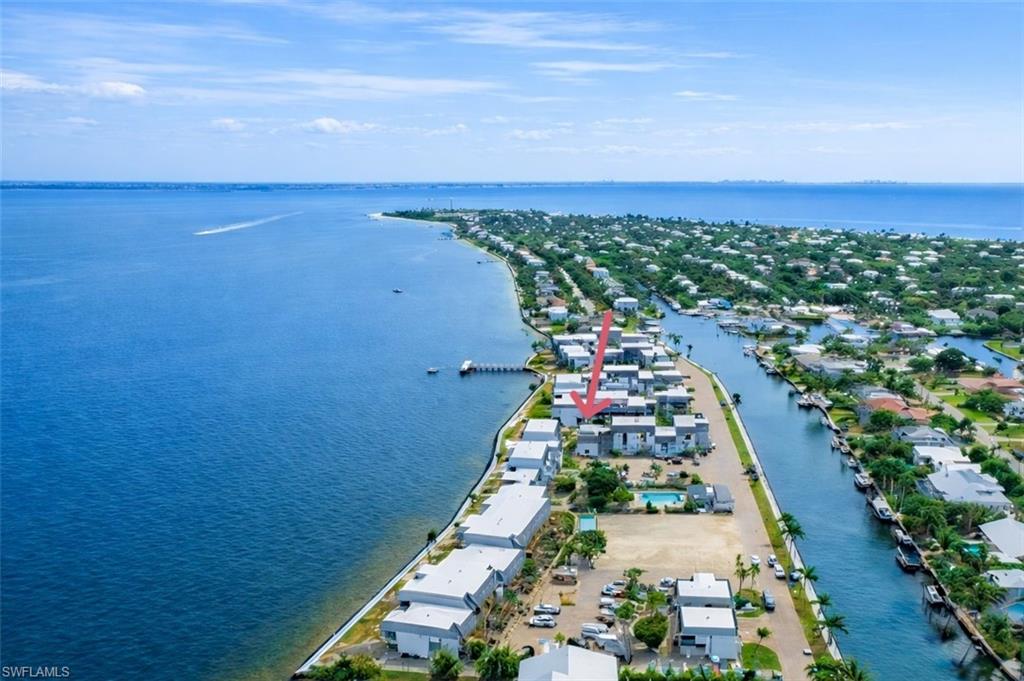 Aerial perspective of suburban area with a large body of water