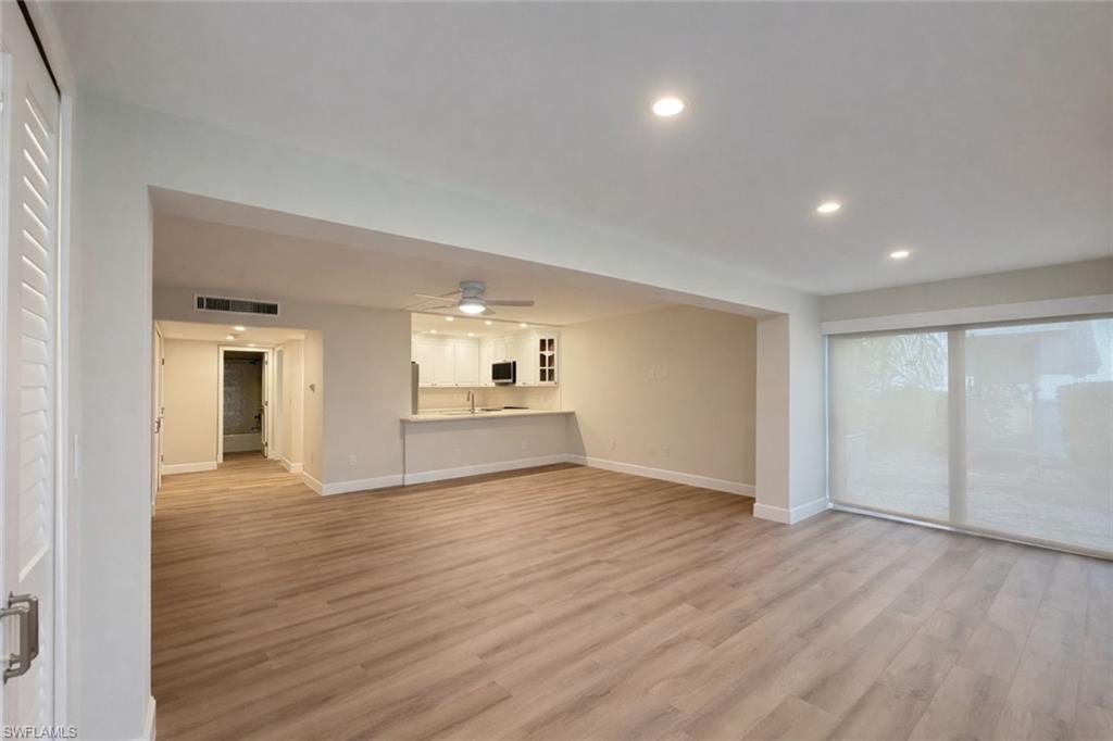Unfurnished living room featuring recessed lighting, light wood-style floors, and a ceiling fan