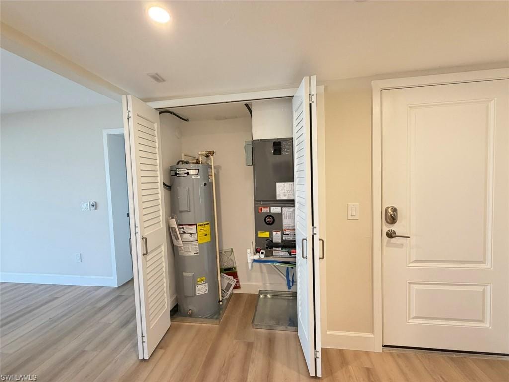 Utility room with water heater and heating unit