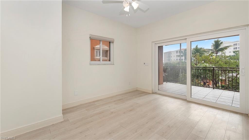 Unfurnished room featuring light wood-type flooring and ceiling fan