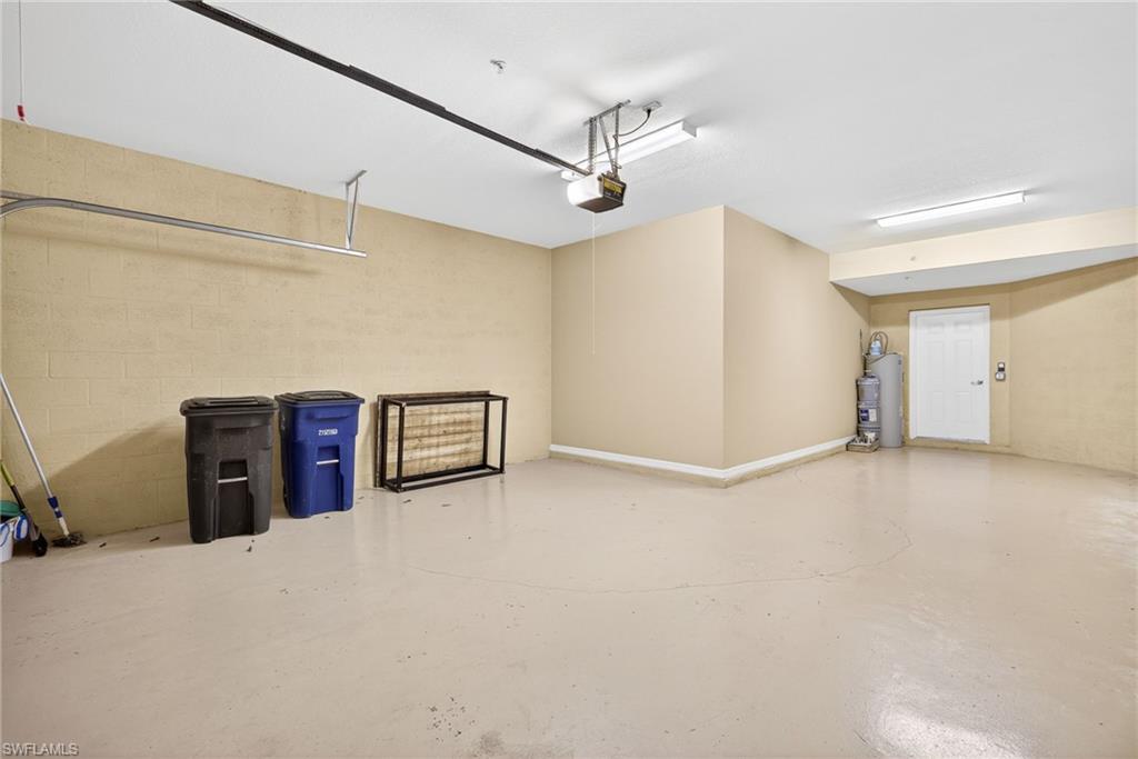 Garage with concrete block wall and a garage door opener