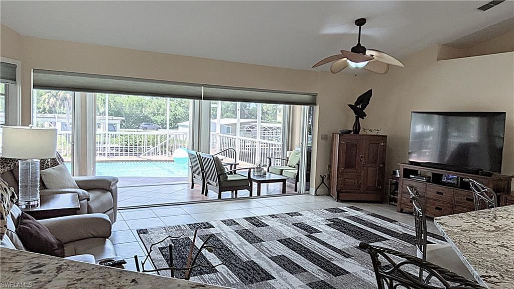 The Heart of the Home:  The Family Room features QUADRUPLE Pocketing Sliding Doors and Custom Blinds