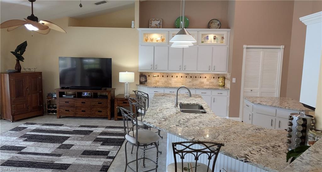 Your Family will Enjoy the Convenience of Meals Served on this Expansive Kitchen Island or in the Adjacent Dining Room