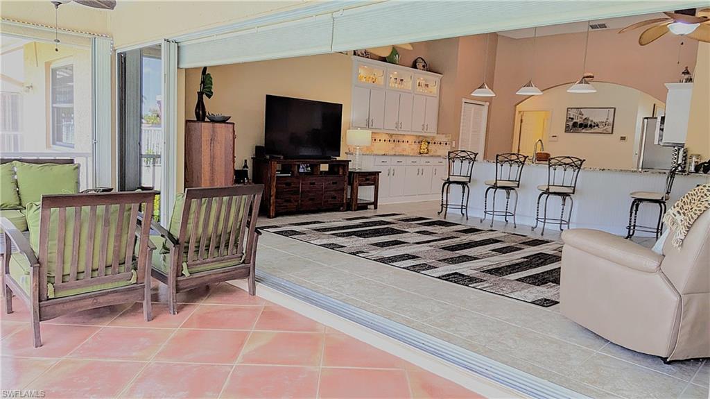The Family Room Transitions Seamlessly onto the Entertainment size Lanai which is Surrounded by Ambient Night Lighting