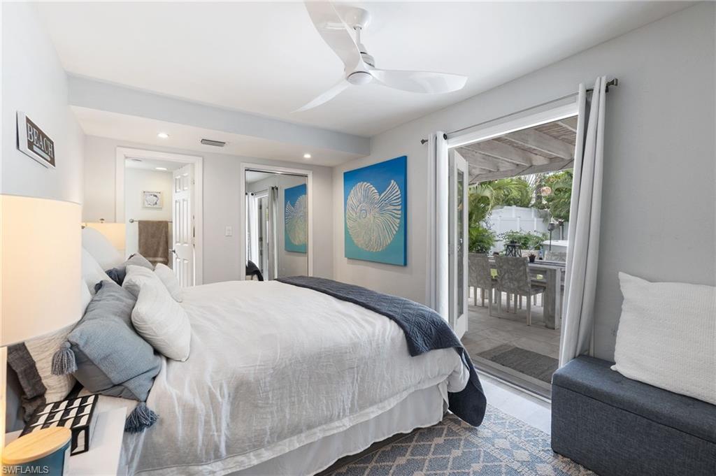 Bedroom featuring access to outside, a ceiling fan, and recessed lighting