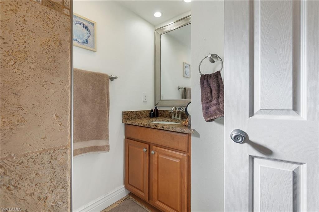 Bathroom featuring vanity and recessed lighting
