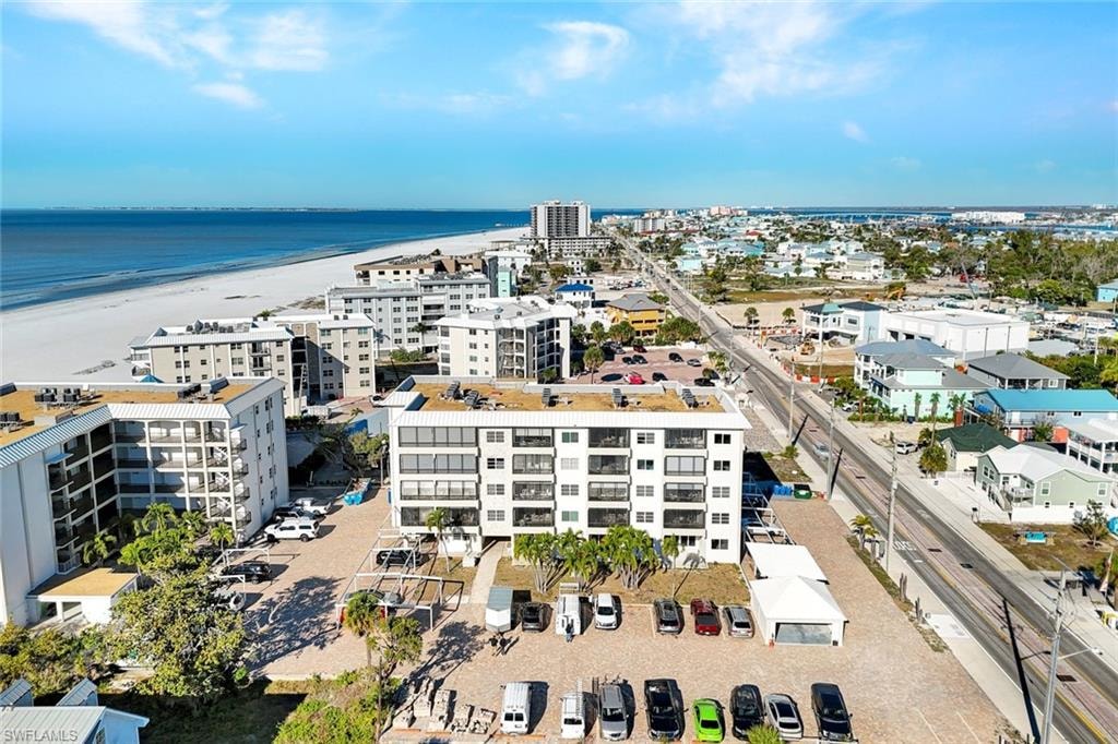 Aerial view of expansive coastline and apartment complex / building