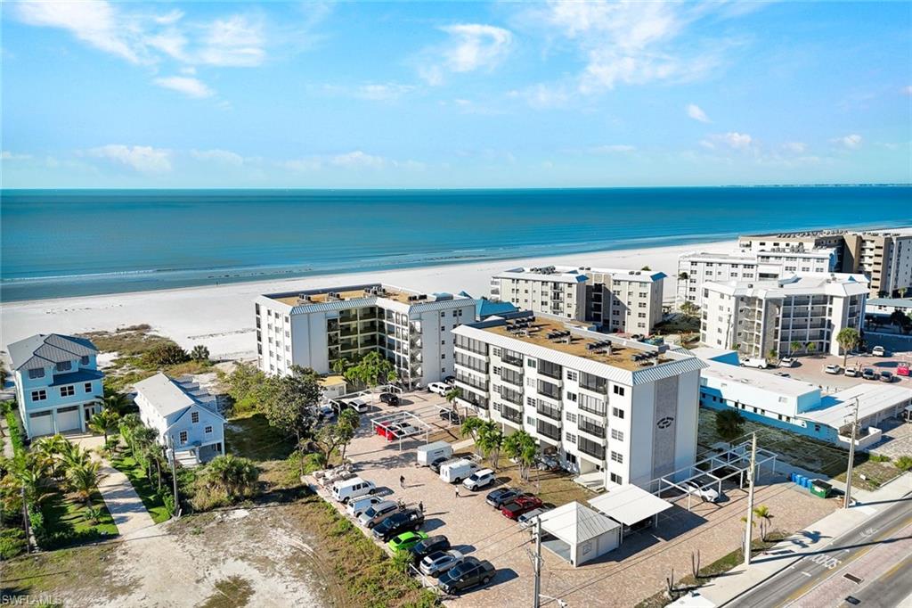 Bird's eye view of apartment complex / building and expansive coastline