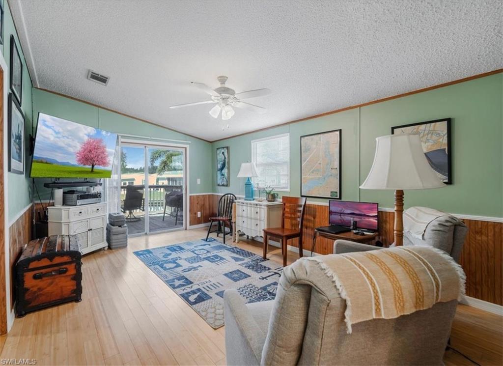 Sun-filled, bright and airy bonus room with abundant natural light and sliders that seamlessly open to the deck—perfect for relaxing or entertaining
