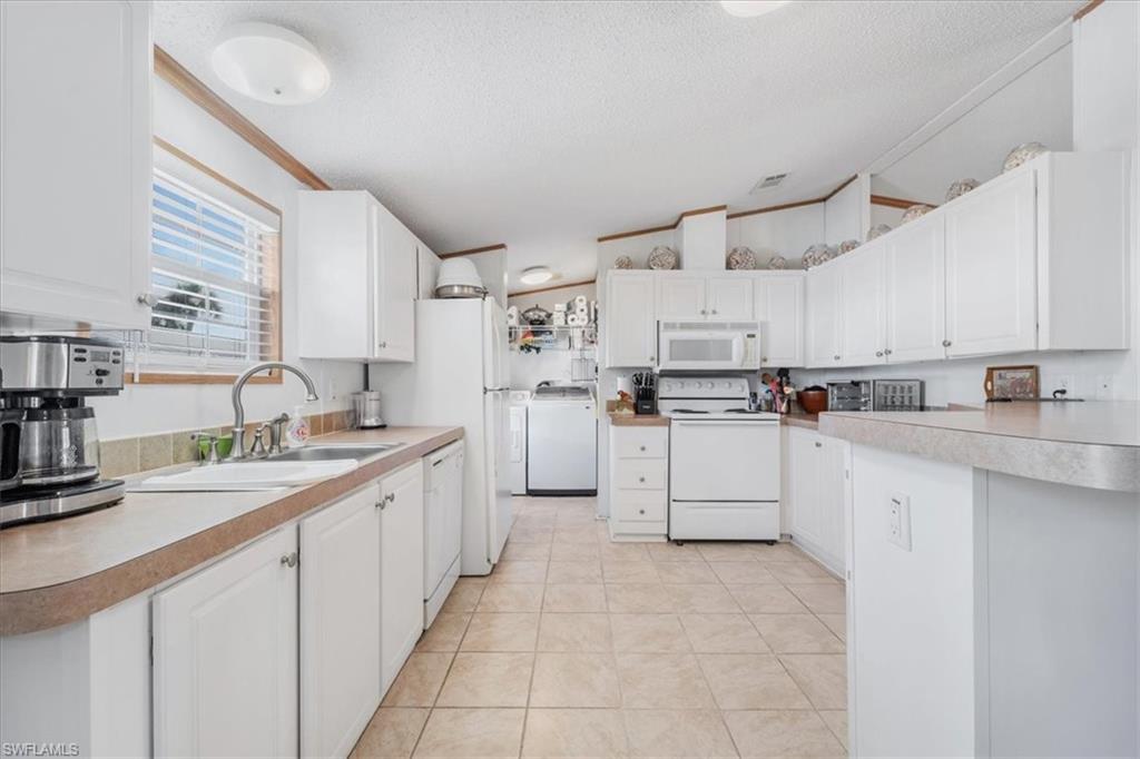 Generous kitchen featuring abundant cabinetry and exceptional storag