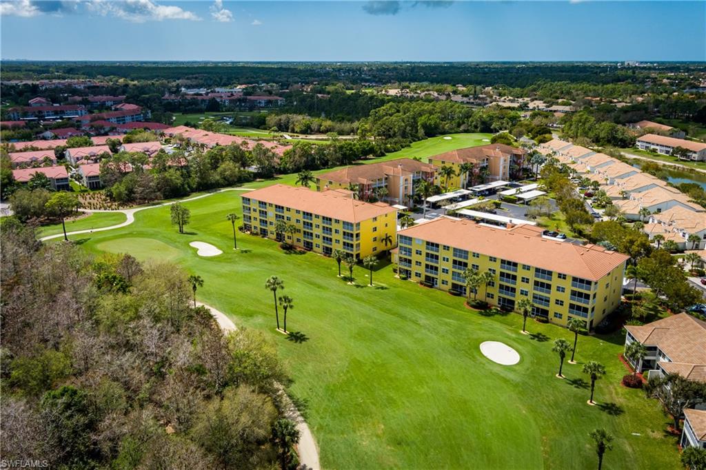 Aerial view of apartment complex and a golf club