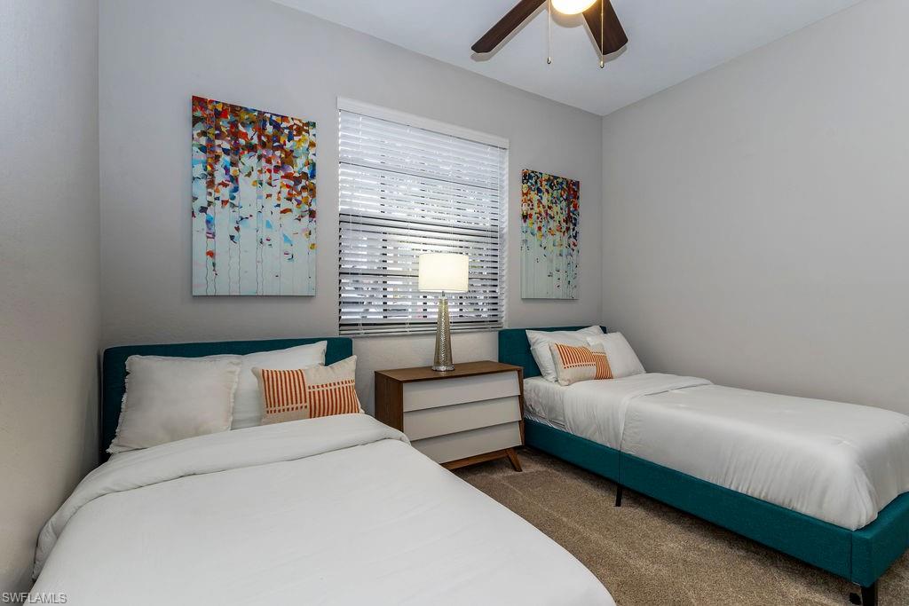Bedroom with carpet flooring and ceiling fan