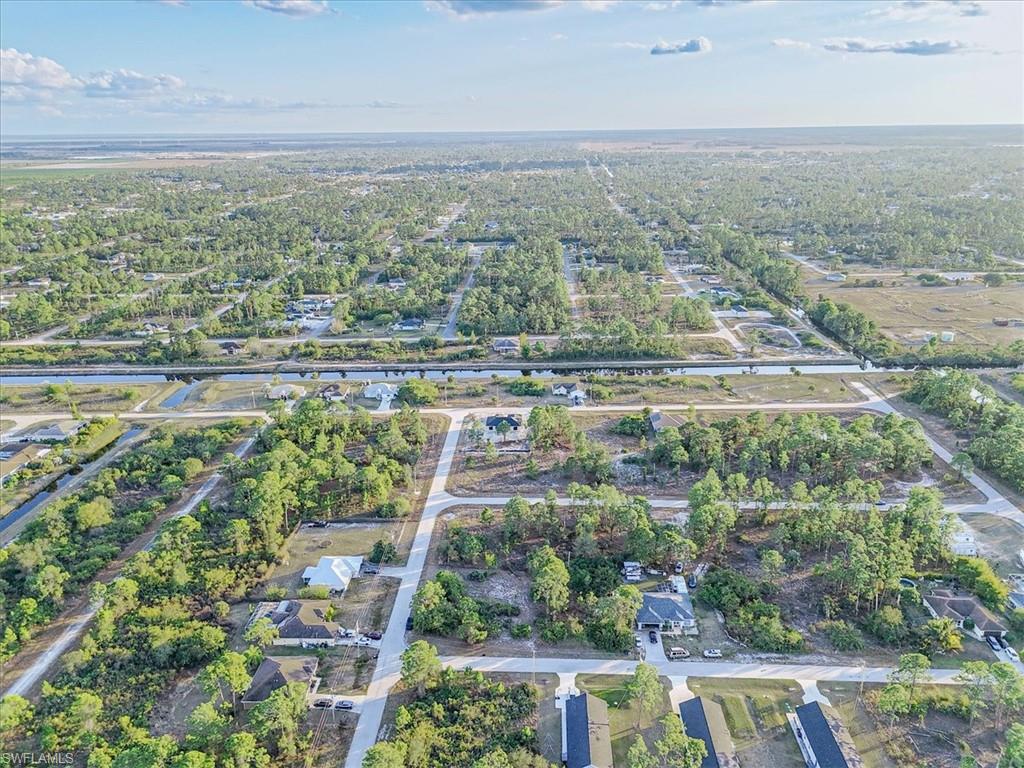 Aerial overview of property's location featuring nearby suburban area