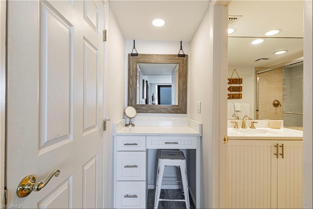 Bathroom featuring vanity and tiled shower