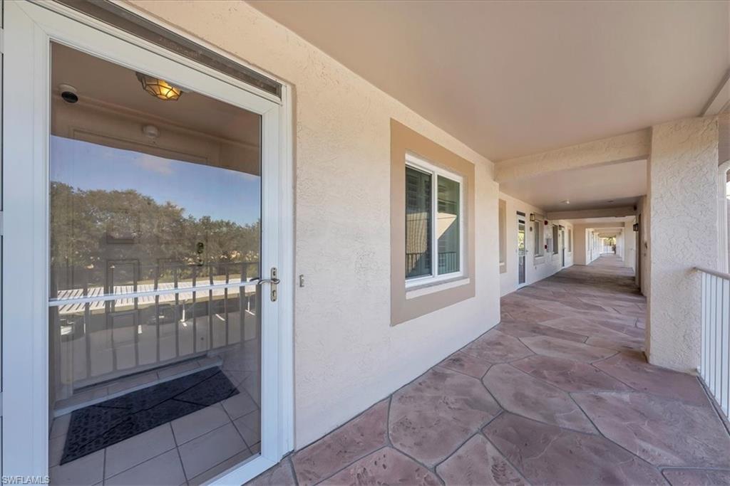 View of exterior entry with stucco siding