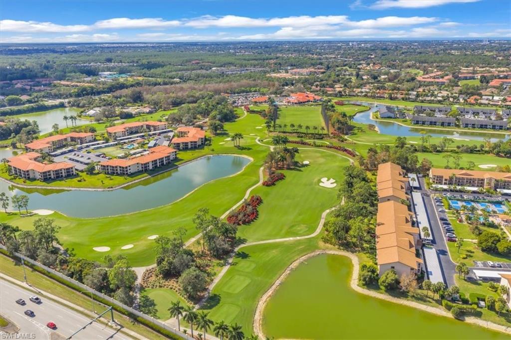 Drone / aerial view of a golf course and a large body of water