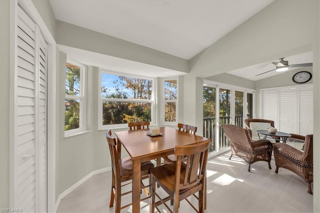 Sunroom / solarium featuring lofted ceiling and plenty of natural light