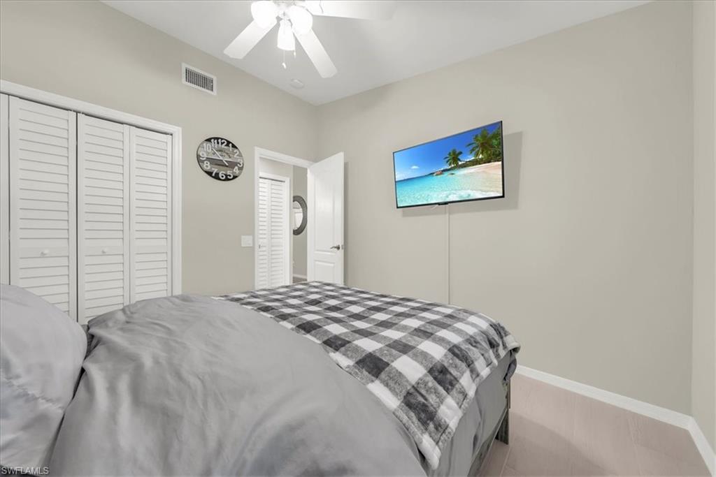 Bedroom with a closet and a ceiling fan