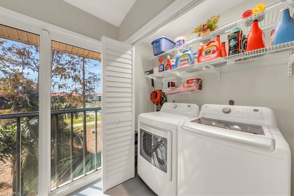 Washroom with washer and clothes dryer