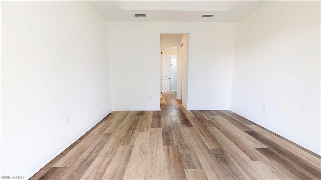 Empty room featuring light wood-style floors and baseboards