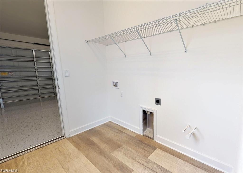 Washroom with electric dryer hookup and washer hookup