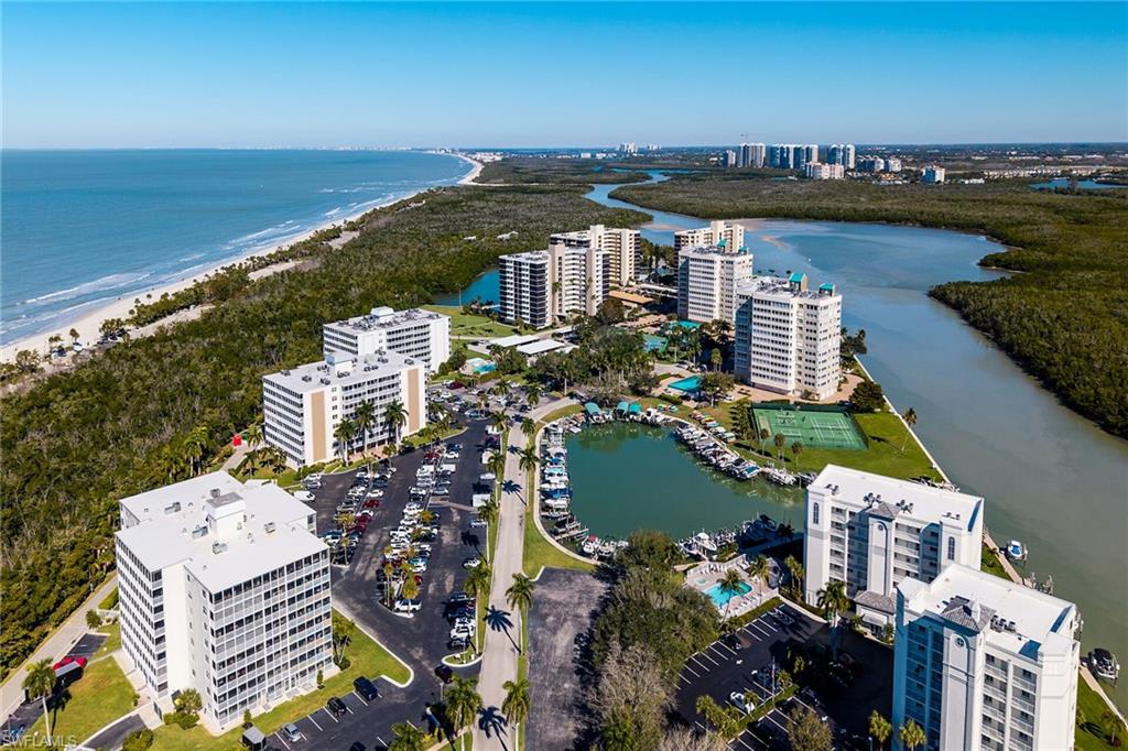 View of urban area with a large body of water and apartment complex
