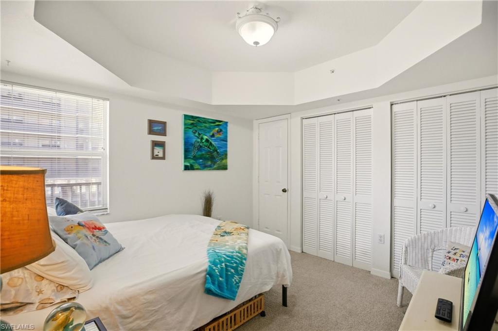 The corner guest room features a trey ceiling and 2 closets