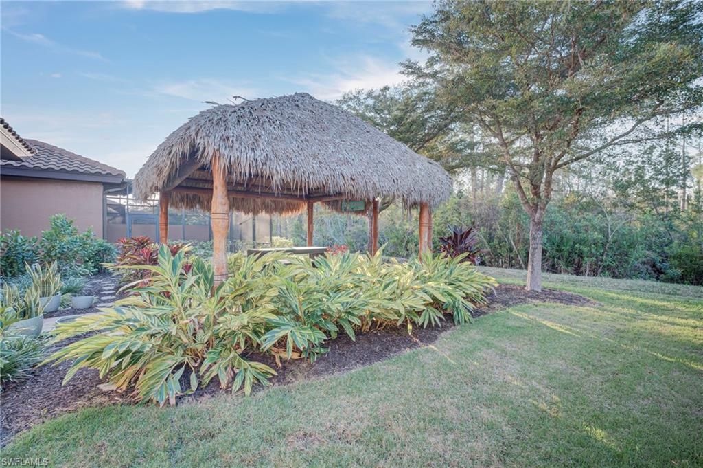 View of grassy yard featuring a gazebo
