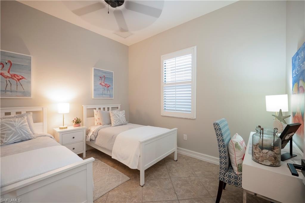 Bedroom featuring a ceiling fan and light tile patterned floors