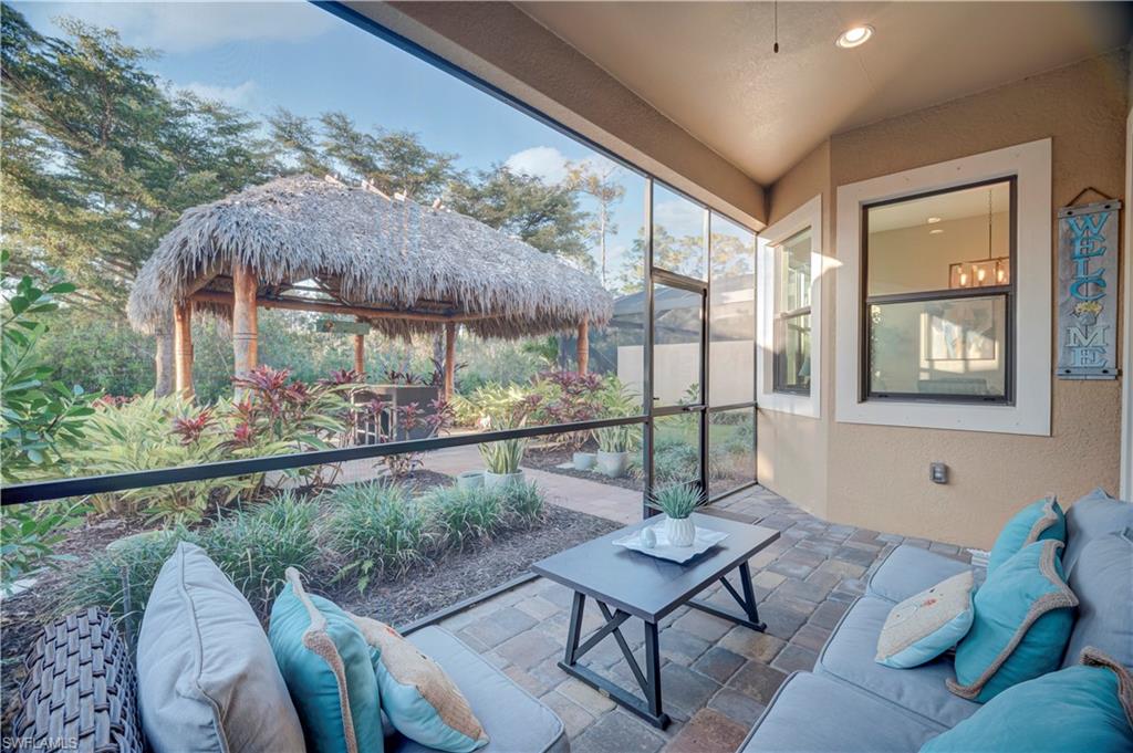 Sunroom / solarium featuring a patio