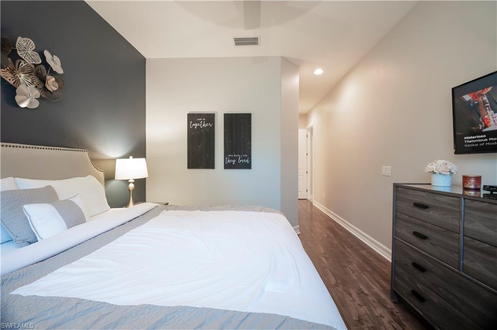 Bedroom featuring recessed lighting, ceiling fan, and dark wood-type flooring