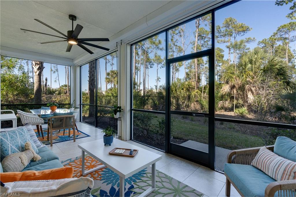 Oversized lanai with tile flooring and expansive view.
