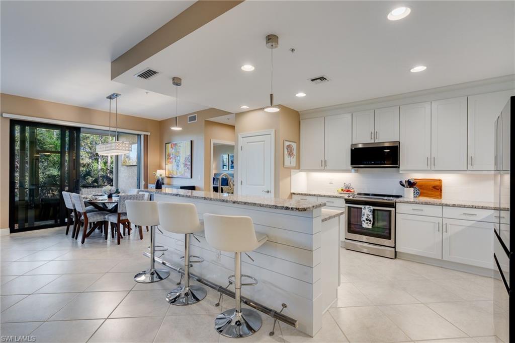 Kitchen peters, LED ceiling, lighting, upgraded backsplash, and newer Samsung Bespoke refrigerator and microwave.