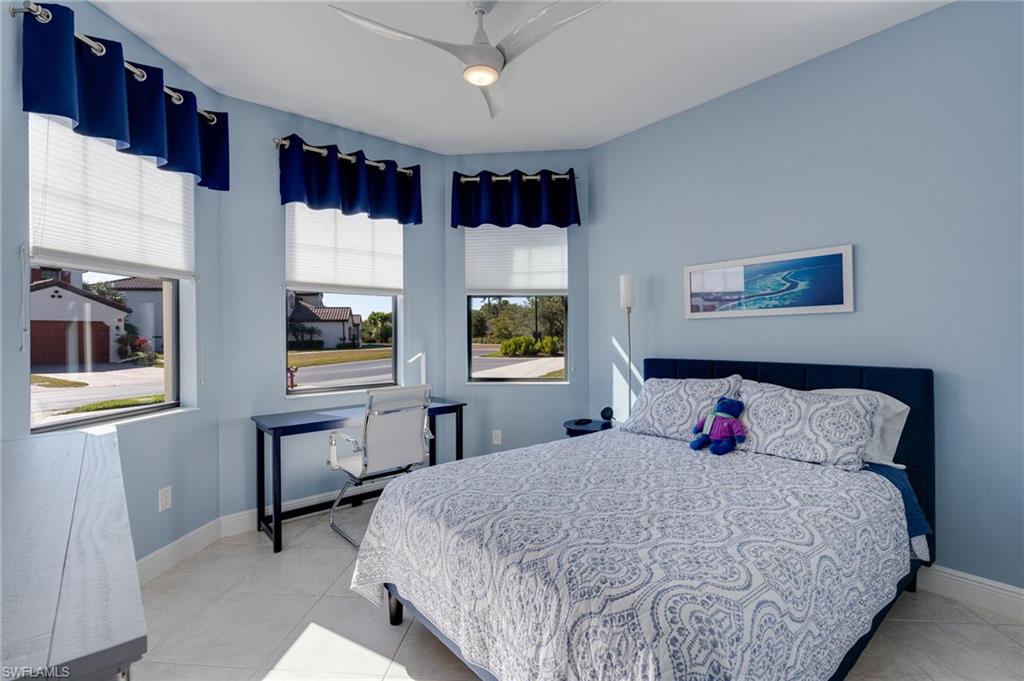 Guest Bedroom featuring upgraded ceiling fan and triple impact windows for lots of light.