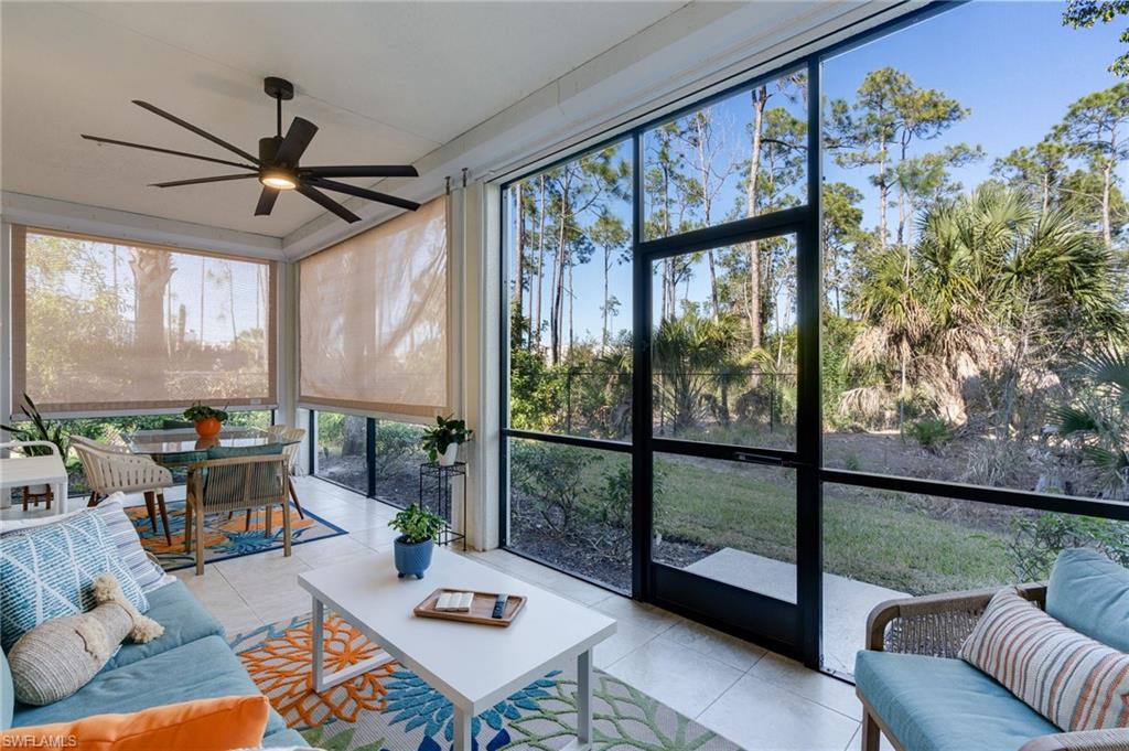 Oversized lanai showing additional storm protection with Kevlar automatic shades.