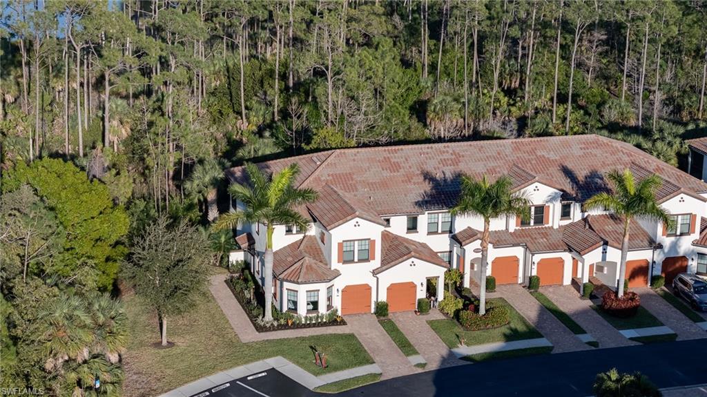 Aerial view of property and surrounding green preserve.