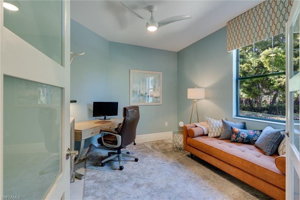 Carpeted den with fresh paint, tons of light and updated fan/light.  And NEW 3-panel frosted doors to allow light and offer privacy.