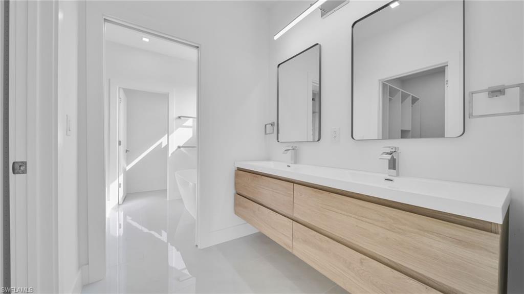 Full bathroom with double vanity