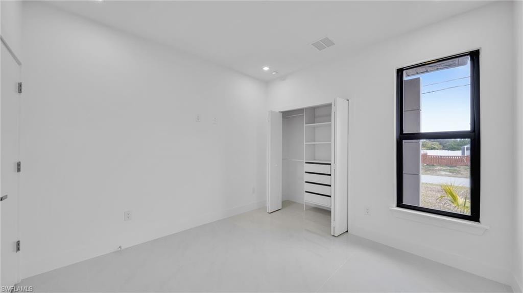 Unfurnished bedroom featuring a closet and recessed lighting