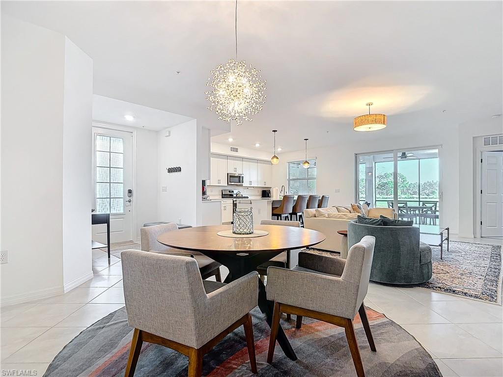 Tiled dining room with an inviting chandelier