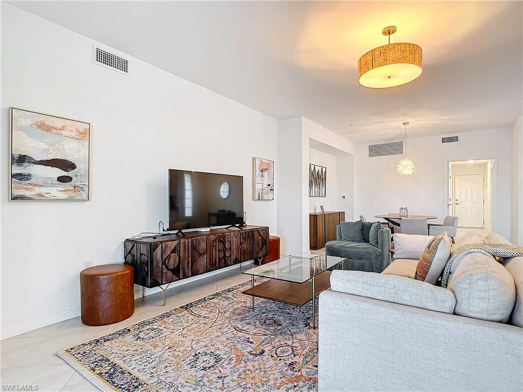 Living room with light tile patterned floors
