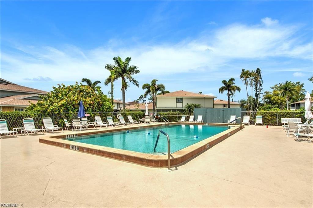 Community pool with a patio area