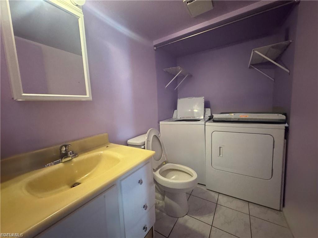 Full bathroom with vanity and washing machine and dryer