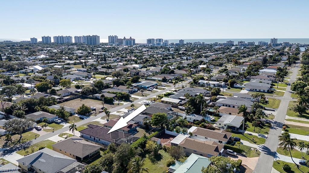 Aerial overview of property's location with city skyline