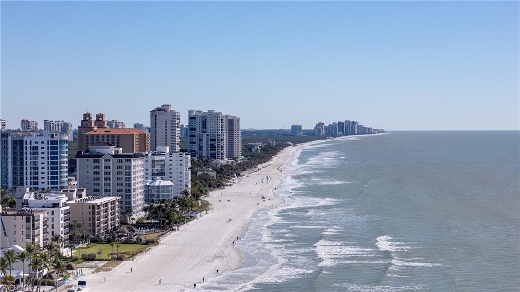 Water view featuring city skyline and nearby beach